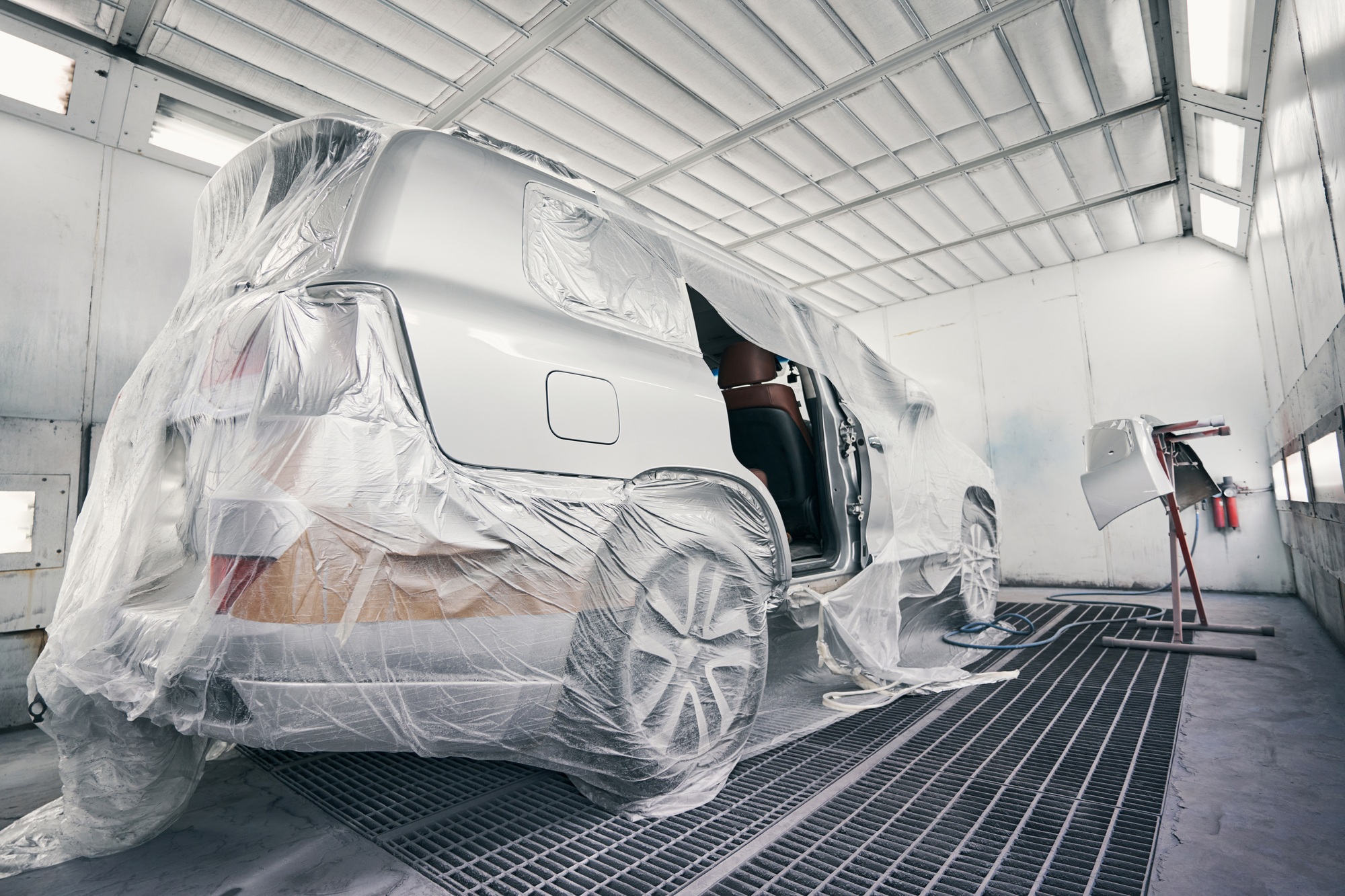 Car in a coating room ready for painting